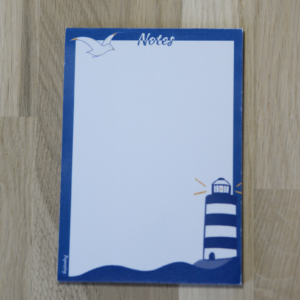 Petit bloc-notes bleu illustré d'un phare