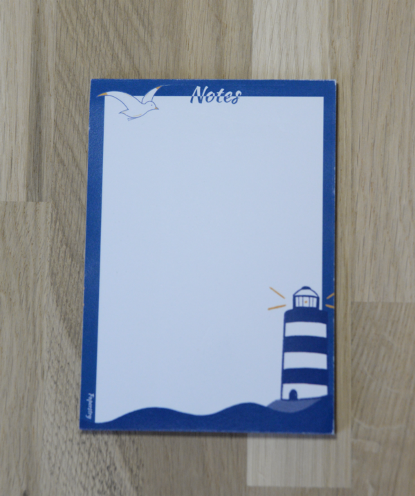 Petit bloc-notes bleu illustré d'un phare